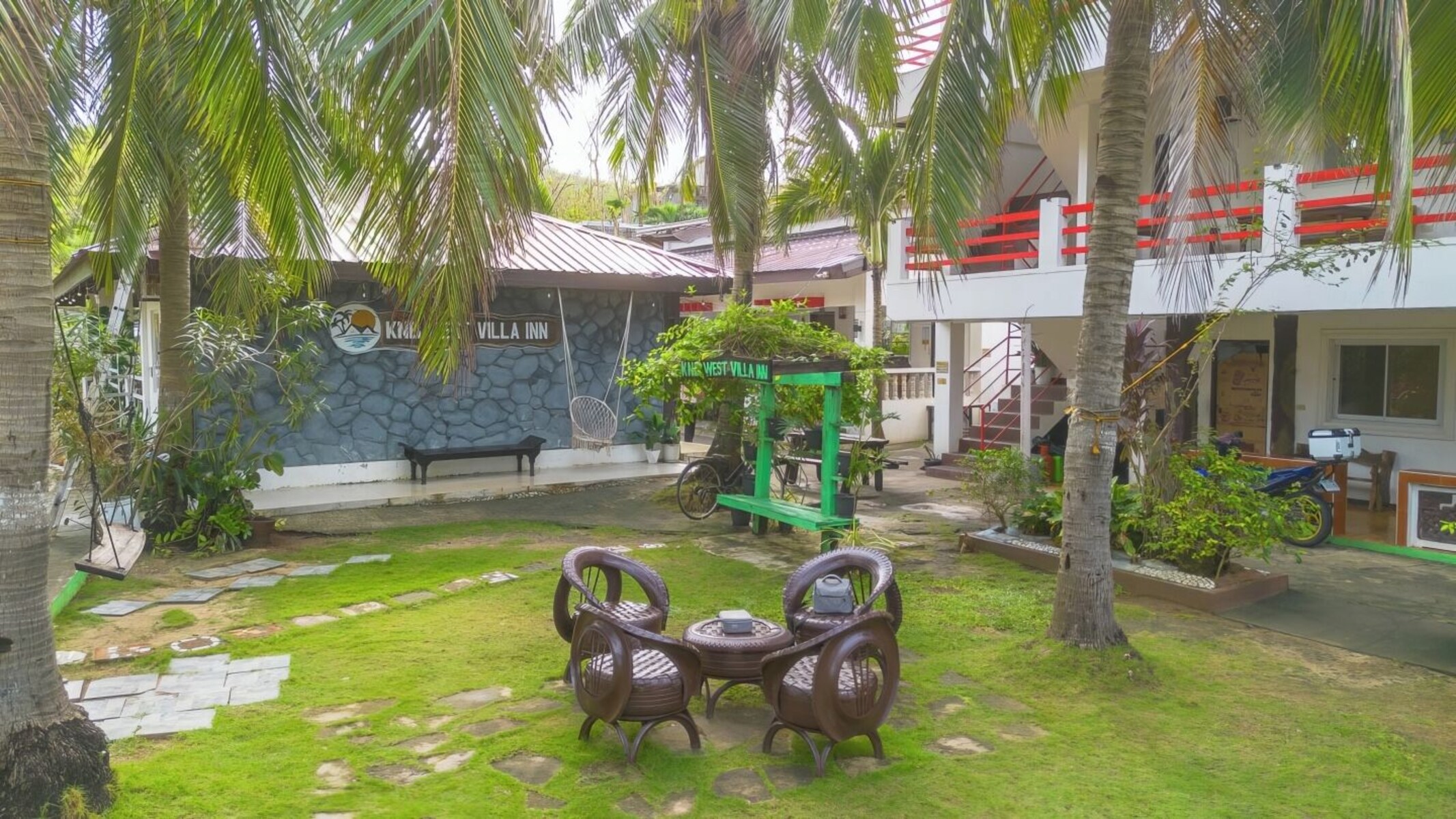 Tropical garden courtyard at KNB West Villa Inn